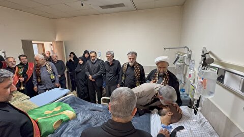 عیادت خادمین ستاد توسعه و بازسازی عتبات عالیات استات البرز از مجروحان جنگ ۱۲ روزه در روز تاسوعا